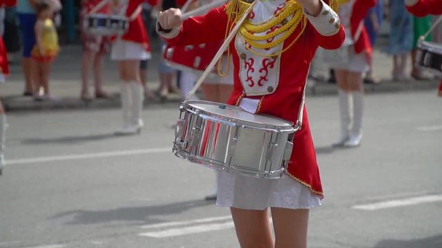 Close-up of female hands drummers are knocking in the drum of their sticks. Slow motion