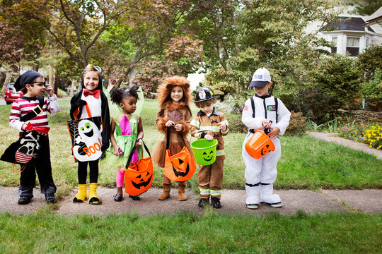 Portrait of children (2-3, 4-5) wearing costumes on halloween