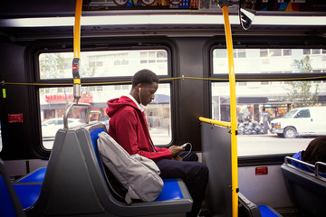 Teenage boy traveling by bus © Cavan for Adobe