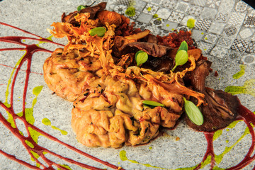 top view closeup sheep brain with mushrooms and meat