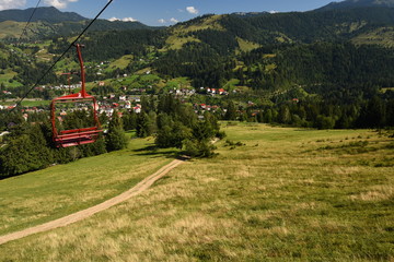 Chairlift ride in the Carpathian Mountains (Romania).