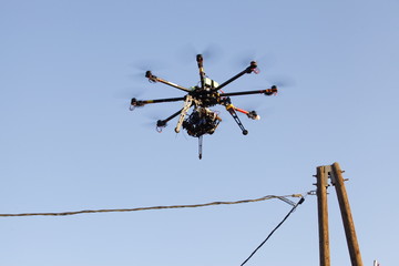 Flying drone with sky and clouds background