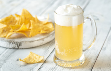 Mug of beer with tortilla chips