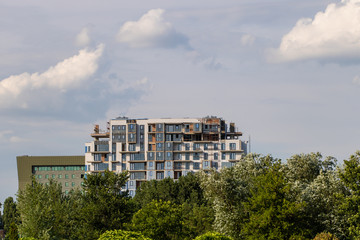 A modern building under construction, finishing works