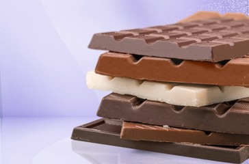 Delicious chocolates isolated on  background