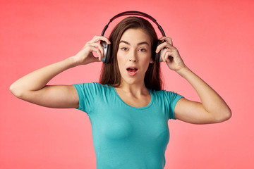 young woman listening to music with headphones