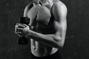 Fototapeta na wymiar muscular man lifting weights