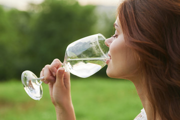 young woman drinking water from a bottle