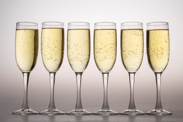 Six Champagne Glasses on Grey Background
