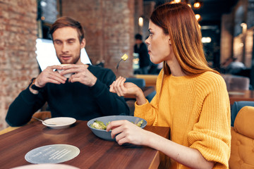 young couple having dinner in restaurant