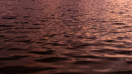 Sea water background. Waves, water surface. Night view.