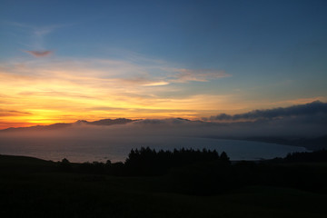Sunset over the bay on Kaikoura peninsula, South Island, New Zealand