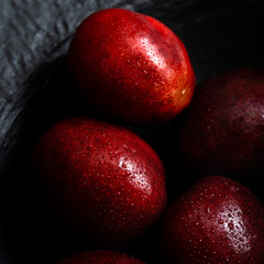 Cherries macro shot black plate mood