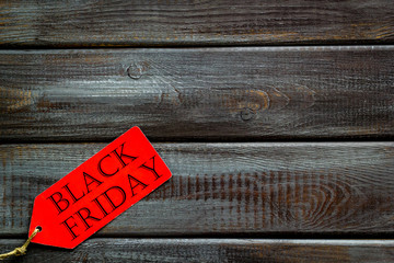 Black friday labels in discount on wooden background top view mock up