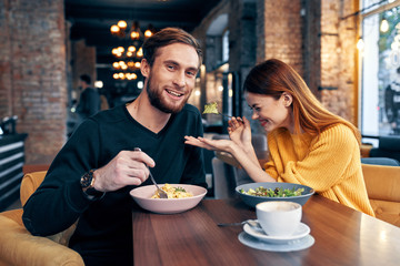 young couple having dinner in restaurant
