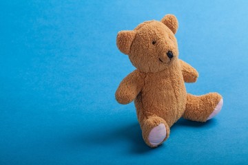 Teddy bear on blue surface