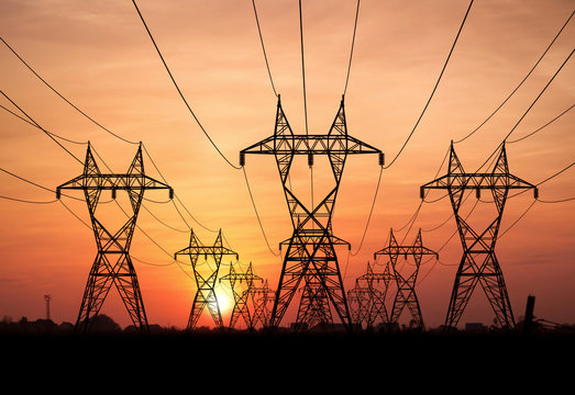 electricity pylons at sunset