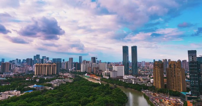 Time lapse cityscape of Chengdu city of Sichuan China in Cloudy summer afternoon with busy traffic cars driving on the road  2019 wangjianglou park and jinjiang river