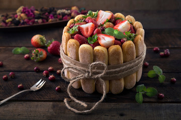  cookies and strawberries on wooden background