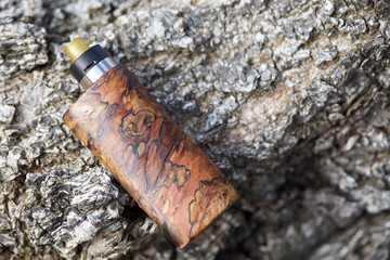 high end natural stabilized wood box mods with rebuildable dripping atomizer, vaping device, selective focus