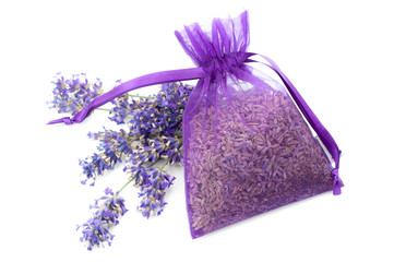 Summery flower fragrance, relaxing naturist gift and floral scent concept theme with dried lavender in a violet cloth bag next to fresh purple flowers isolated on white background
