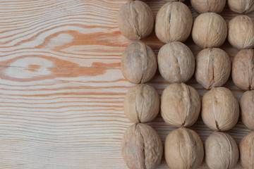  ripe walnut on wooden background