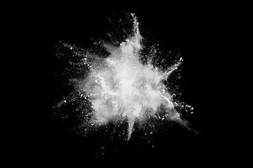 White powder explosion on black background. Colored cloud. Colorful dust explode. Paint Holi.