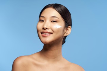 portrait of young woman on blue background