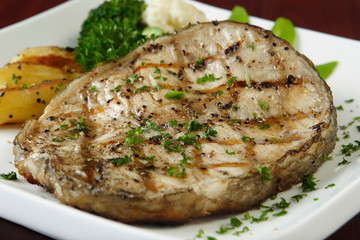 grilled fish steak with salad