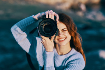 woman taking photo with digital camera