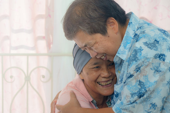 Asian Senior Cancer Patien During Chemotherapy Feel Happy With Big Hug For Her Friend Visit