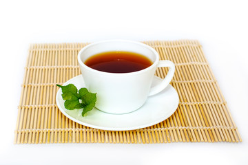 Hot mulberry tea in a cup on the floor Wood  and white background Japan style