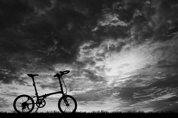 silhouette vintage bike on sunrise