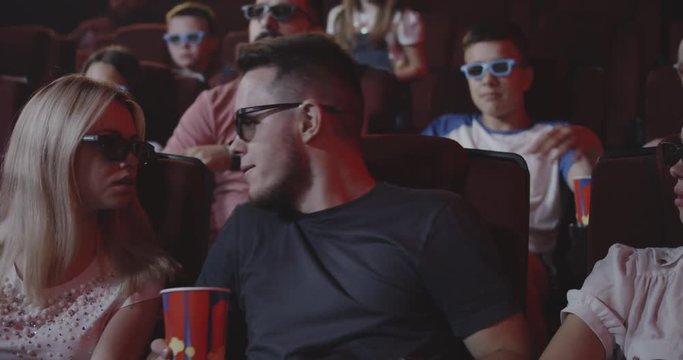 Man spoiling movie for fellow moviegoers in cinema