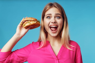 woman with hamburger and french fries