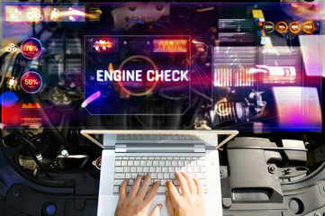 Top view man use laptop to analysis on his car engine Check with hologram. the concept of engine service hologram communication, network, insurance