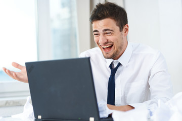 portrait of a businessman working on laptop