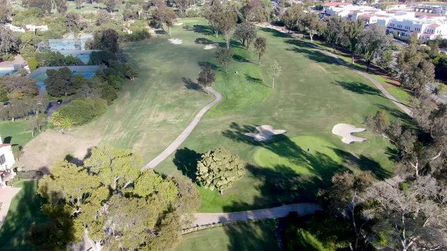 Aerial view of a beautiful wealthy green golf course next the valley, luxury country side area, San Diego, California, USA, 
