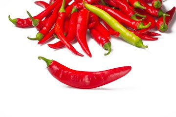 Hot red  and one yellow chili peppers
