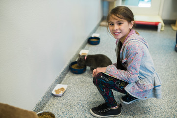 Girl volunteering at animal shelter
