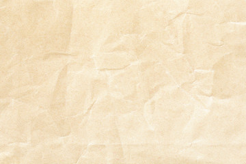 Old pale brown crumpled paper background texture