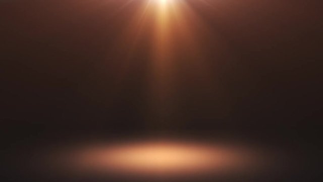 4K Stage lights shining at floor. Scene with yellow spotlight. Flashing rays. Festive gold abstract motion background.