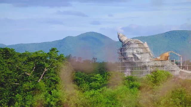 Big and old Buddha images Which the construction is still not finished Faith is faithful.