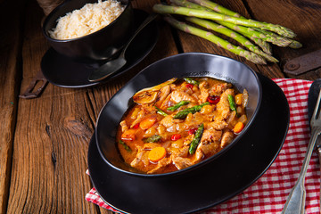 colorful turkey fricassee with asparagus and paprika