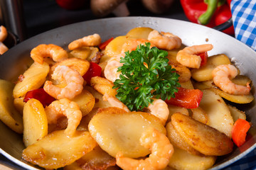 a delicious fried potato and shrimp pan