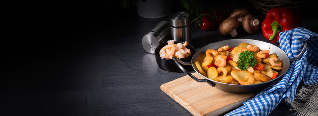 a delicious fried potato and shrimp pan