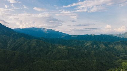 Aerial view of mountains and chewed roads on the mountain during sunset at Khao Kho Viewpoint, Phetchabun Province, Thailand