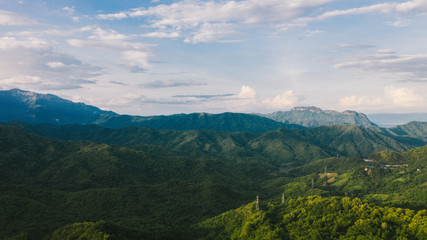 Fototapeta premium Aerial view of mountains and chewed roads on the mountain during sunset at Khao Kho Viewpoint, Phetchabun Province, Thailand