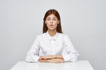 portrait of a young woman sitting at her desk