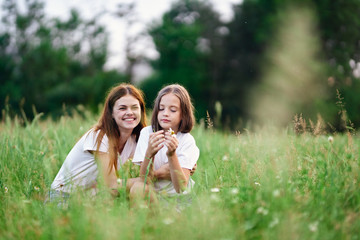 happy mother and daughter in the park